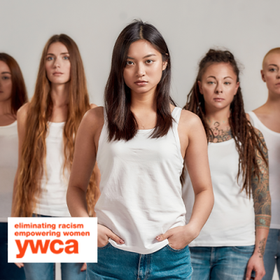 Diverse group of women standing in a line looking at the camera seriously